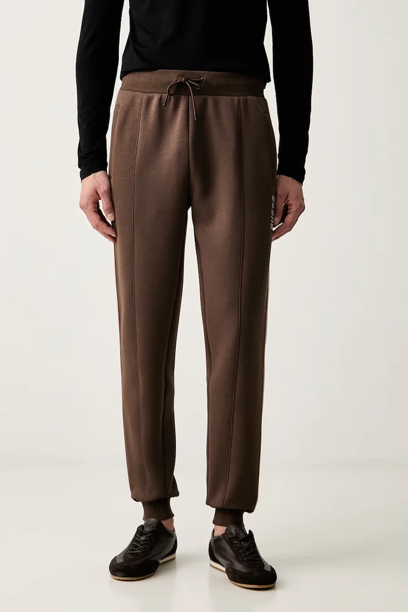 Guess pantaloni de trening pentru bărbați cu bumbac MICKEY